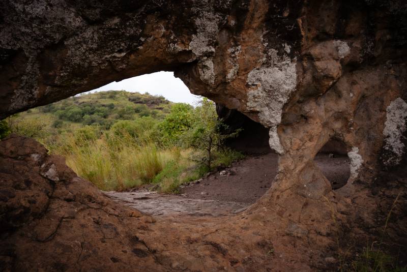 A rock shelter looking out over the hills