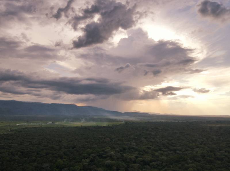 Rain falling over the escarpment at dusk
