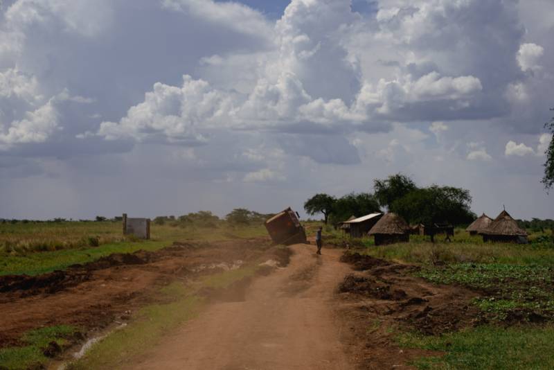 A vehicle on a rutted, waterlogged track in the reserve